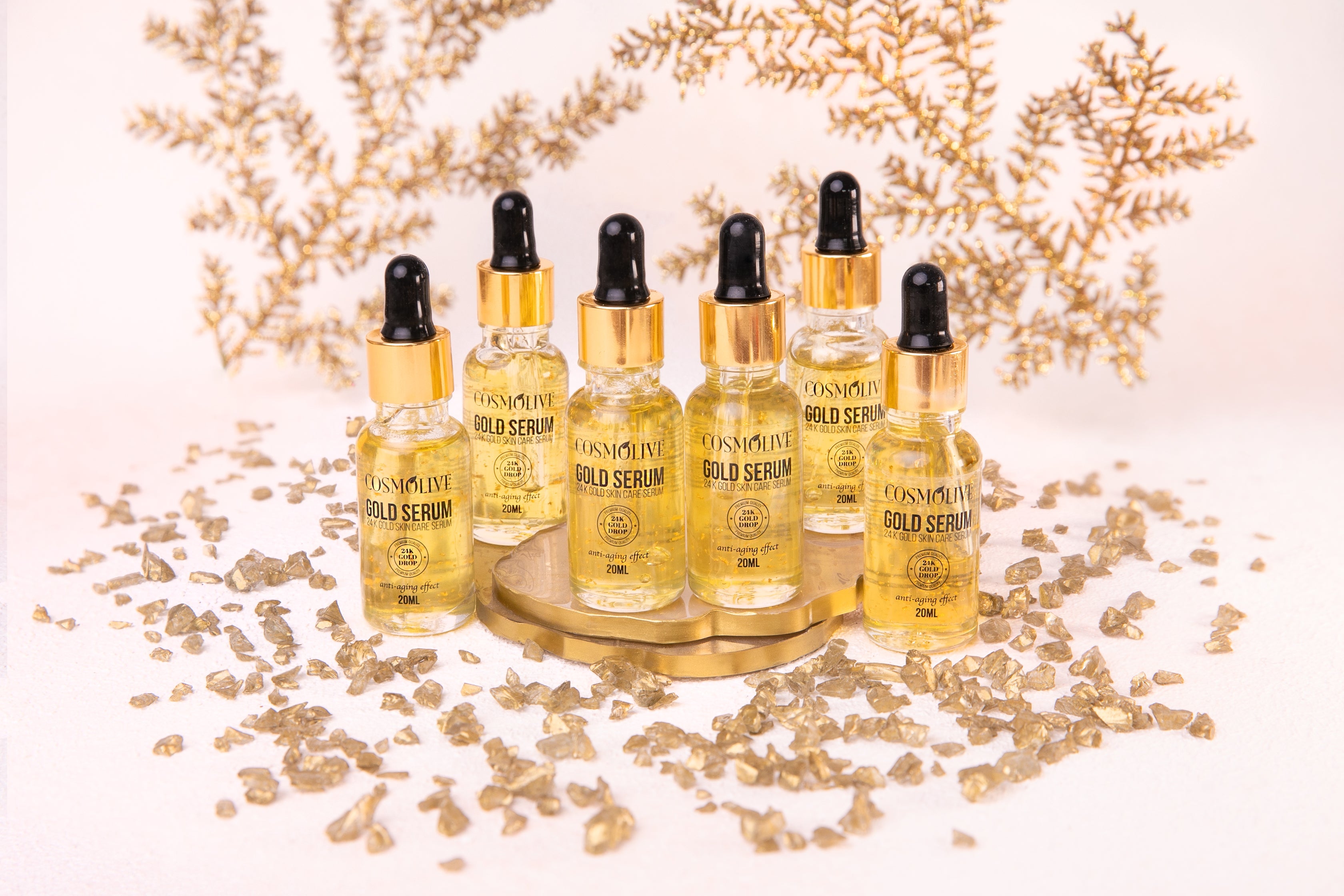 Cosmolive 20ml Gold Serum with 24K Gold, designed to enhance youthful complexion. Vegan, paraben-free, and not tested on animals, it deeply nourishes the skin for a radiant and rejuvenated look.